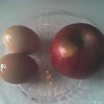 Hard boiled eggs with an apple